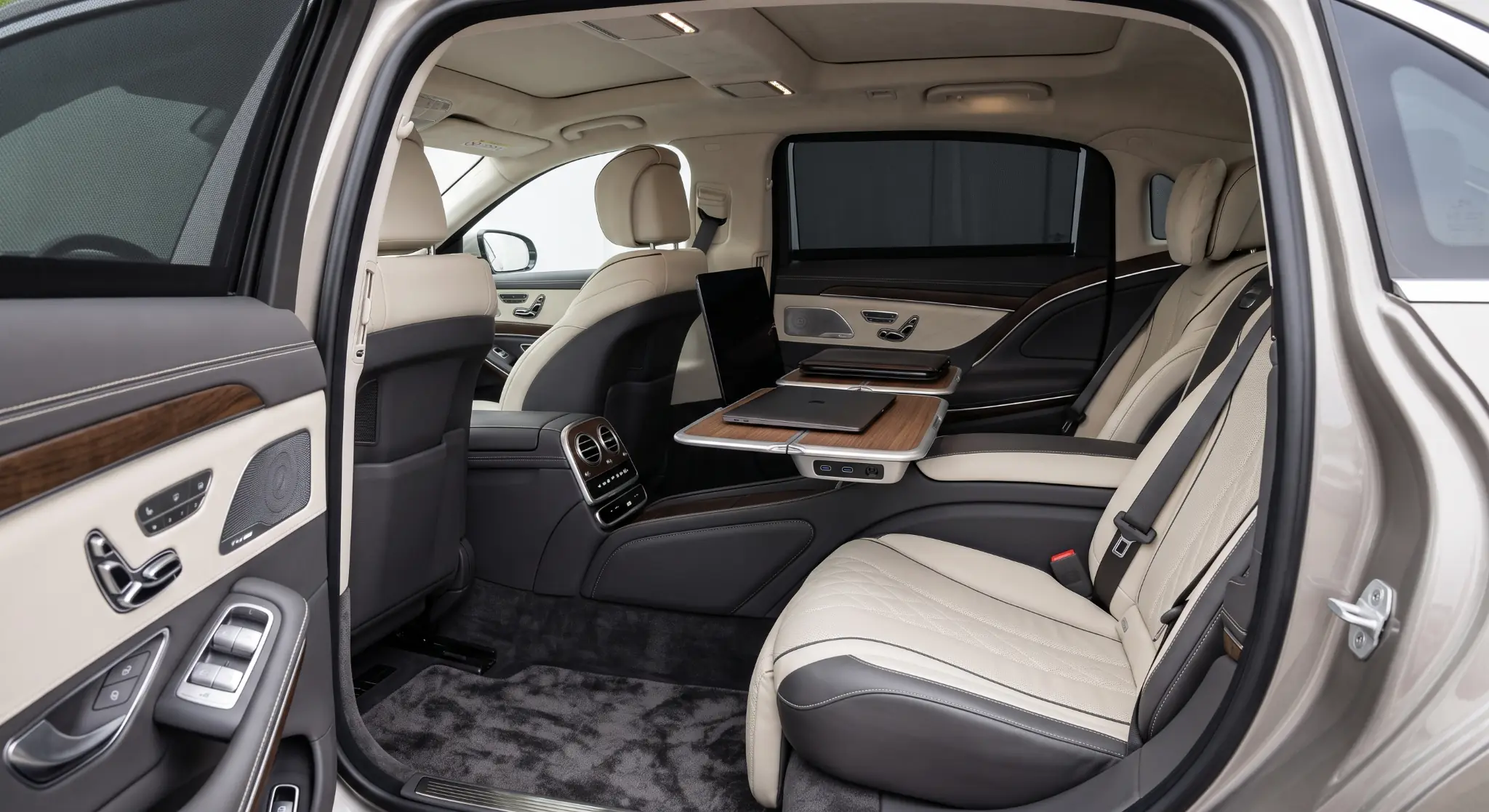 Work-ready executive saloon rear cabin with legroom, charging and fold-out table